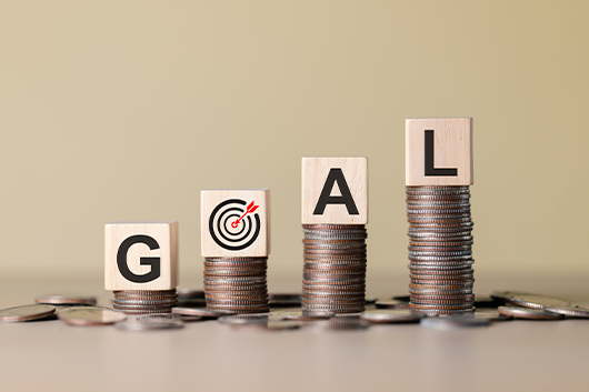 Sign on coins with the word GOAL