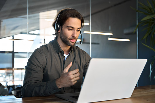 man doin videocall with headphones