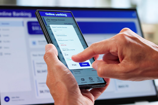 Visual guide on using online banking via smartphone, focusing on essential business checking features for users.